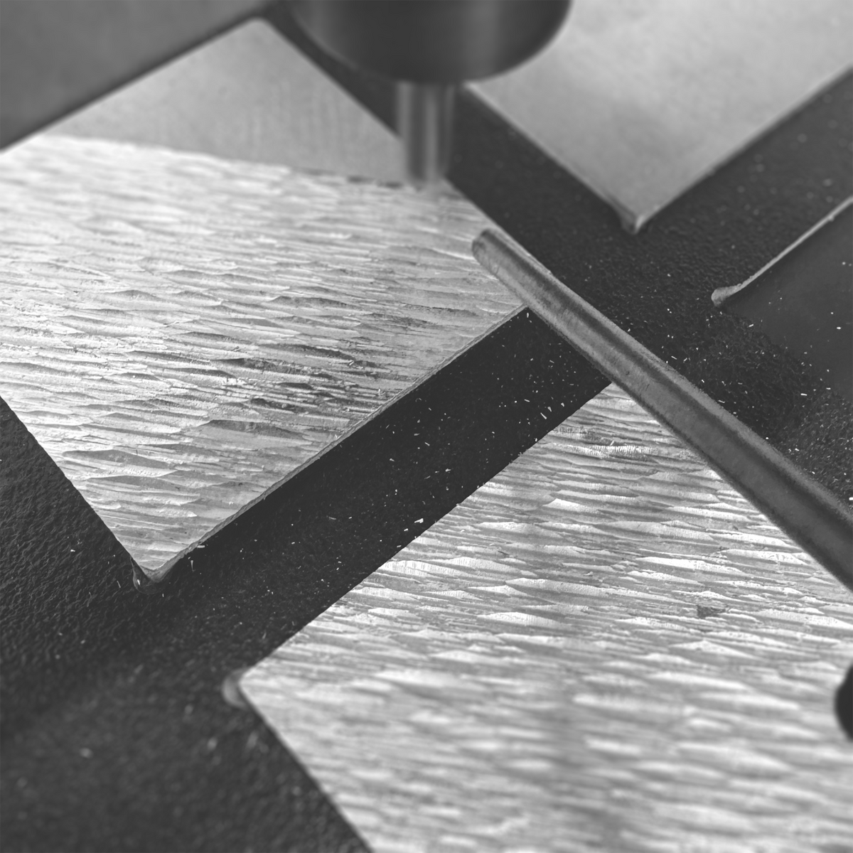 CNC machining directional grooves into a DRIFT aluminum coaster